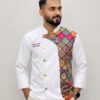 White Chef Coat by SP Uniform – a modern contrast design with vibrant patterned detailing for a distinctive and premium chef uniform look.